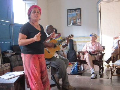 She sings (and talks non-stop) while her husband plays...